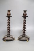 A pair of carved wood twist stem candlesticks, on gilt metal feet, height 39cm