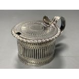 A George IV silver drum mustard, with blue glass liner, Emes & Barnard, London,1824, height 6.7cm,