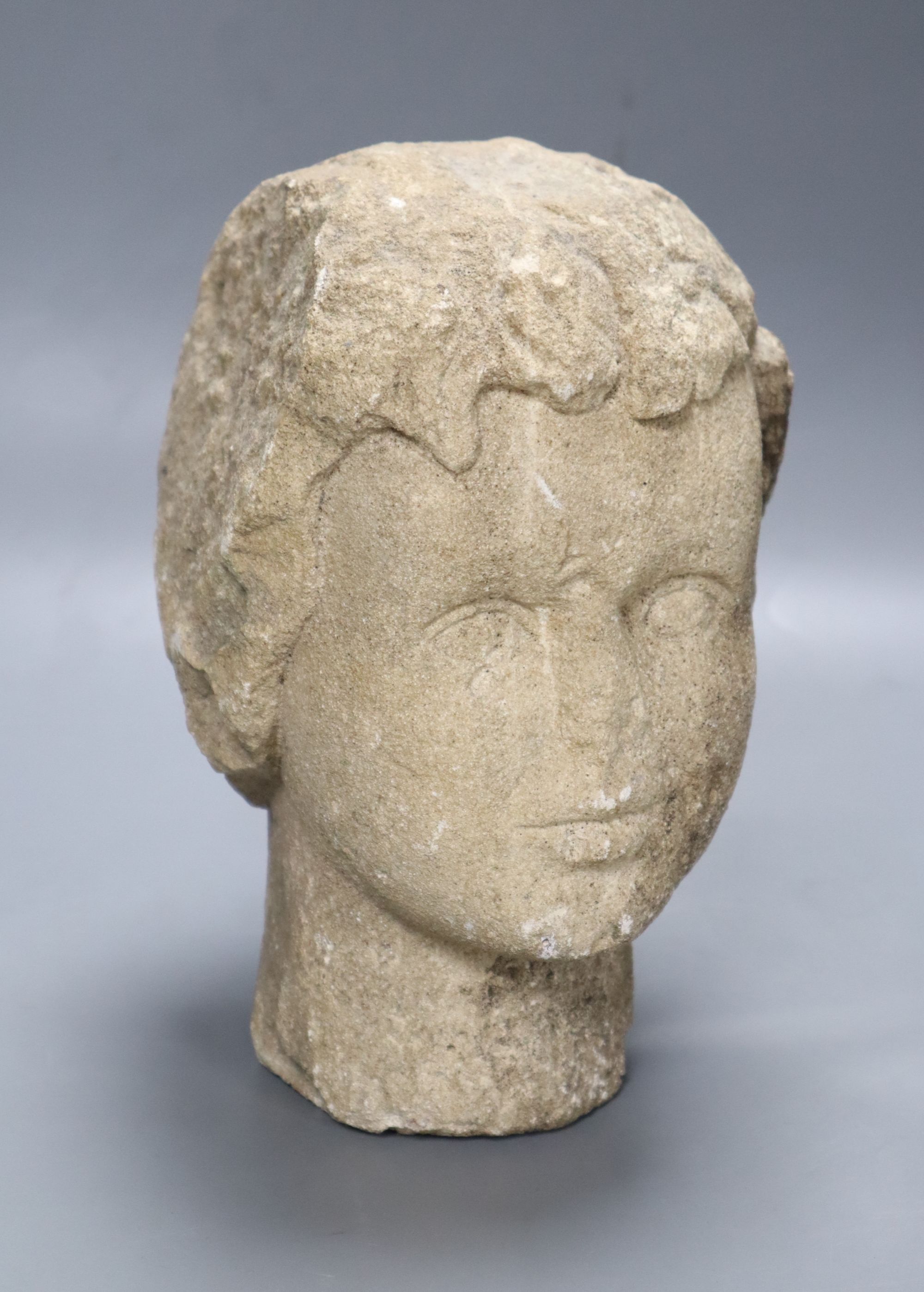 A medieval style stone head, height 23cm