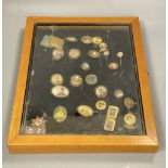 A collection of gilt metal stick pins, brooches, etc. with inset photographic miniatures in glazed