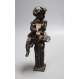 A decorative bronze cherub on pedestal, height 26cm