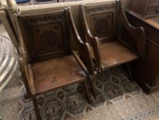 A pair of Glastonbury style walnut carved X frame chairs, width 64cm depth 48cm height 86cm