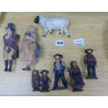 A group of American? painted cast iron and metal Amish figures, sheep money box etc.
