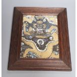 A Chinese embroidered silk and gilt wrapped thread 'dragon' panel fragment, QingCONDITION: