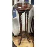 A mahogany two tier jardiniere stand, diameter 28cm height 100cm
