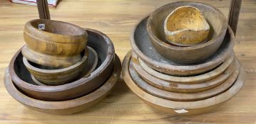 Thirteen large treen bowls, 19th/20th century