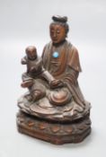 A 19th century Chinese wood group of Guanyin and a child, height 13cmCONDITION: Provenance -