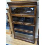 A Globe Wernicke style oak four section bookcase, width 88cm depth 30cm height 140cm