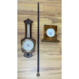 A Victorian silver mounted cane, a wheel barometer and a mantel barometer