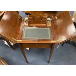 An Edwardian inlaid mahogany 'surprise' writing table, width 48cm depth 49cm height 73cm