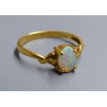 An 18k and single stone white opal ring, size O, gross 2.5 grams.CONDITION: Some minor surface