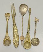 A group of Indian bronze spoons and a forkCONDITION: Provenance - Alfred Theodore Arber-Cooke (c.