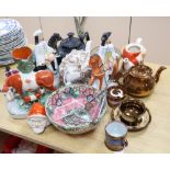 A group of Staffordshire pottery figures, teapots and lustre wares