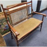 An early 20th century oak two seater chair back settee, width 100cm, depth 50cm, height 99cm
