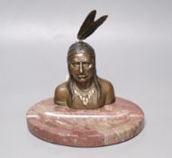 A bronze and marble 'Native American' desk stand, height 19.5cmCONDITION: Part of the cigarette in