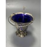 A Victorian pierced silver sugar basket, with blue glass liner and later engraved inscription,