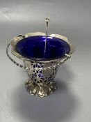 A Victorian pierced silver sugar basket, with blue glass liner and later engraved inscription,