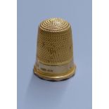 A George V 9ct gold thimble, 20mm, 4 grams.