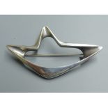 A Georg Jensen sterling abstract brooch, designed by Henning Koppel, no. 376, 67mm.CONDITION:
