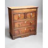 A miniature mahogany chest of drawers, height 33cm