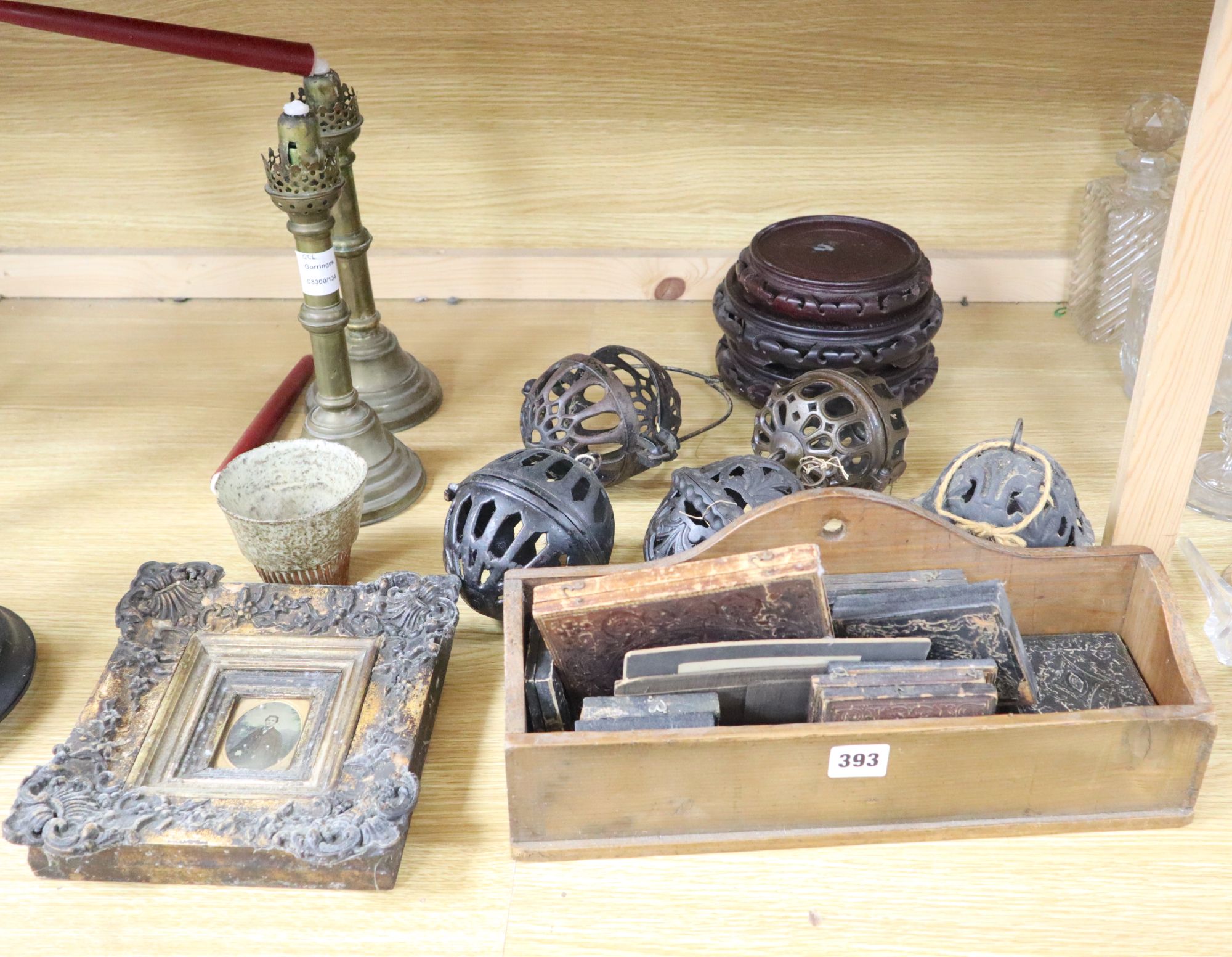 A group of mixed collectables including five pomanders, a pair of brass candlesticks, Oriental