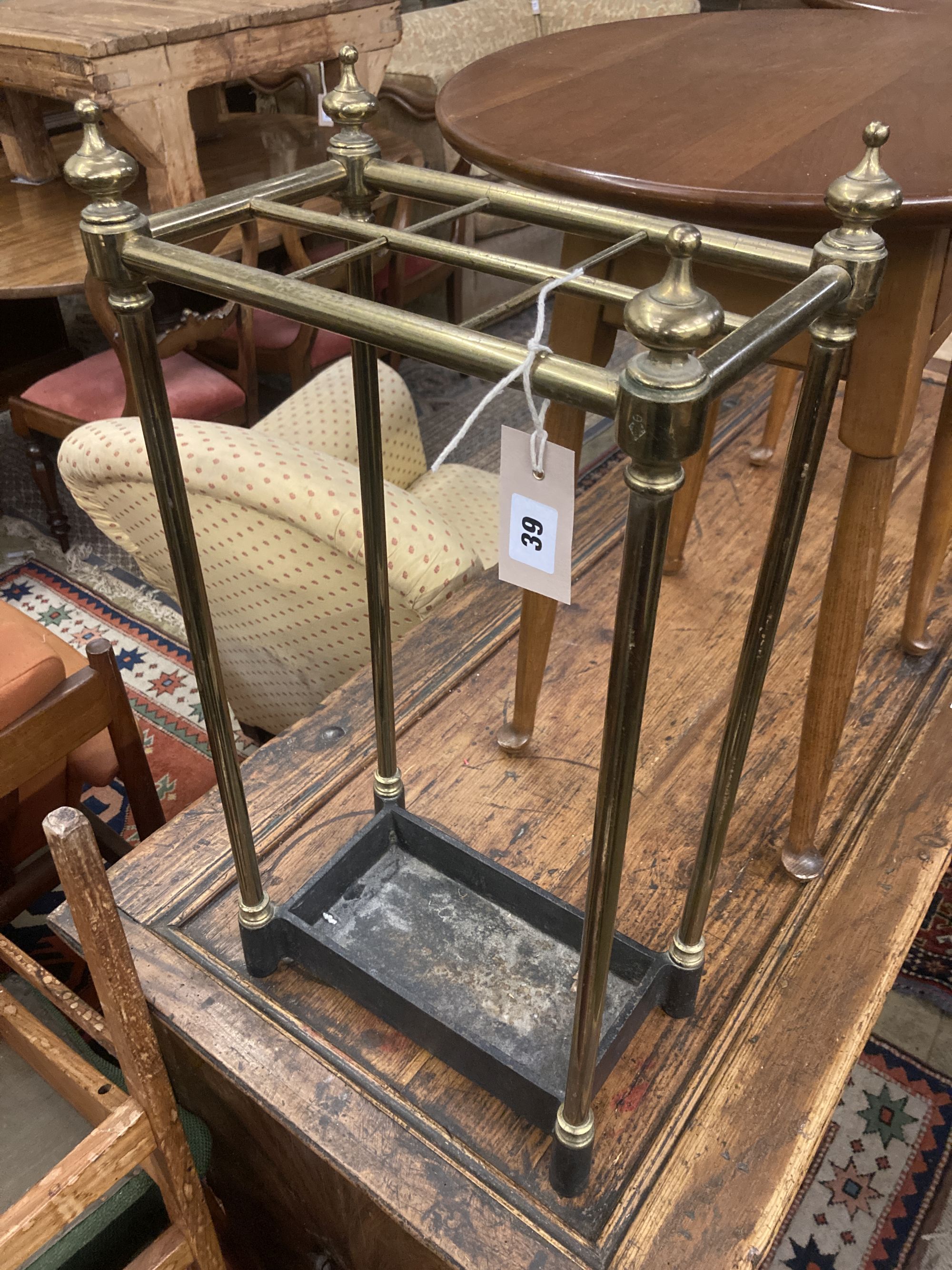 A Victorian brass and cast iron six division stick stand, width 32cm depth 19cm height 62cm