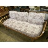 An Ercol beech three-seater 'Surfboard' settee/daybed, width 208cm depth 76cm height 80cm