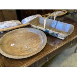 A circular treen shallow bowl and a painted toleware trug, width 69cm, depth 36cm, height 32cm