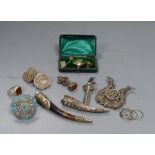 Assorted Chinese white metal items including a menu holder, nail guard, charms, brooches etc.