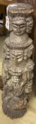 A South East Asian carved column, 90cm high