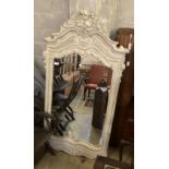 A composition rococo style overmantel mirror, width 100cm height 194cm