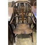 A set of ten stained ash and elm Windsor chairs with crinoline stretchers (two having arms)