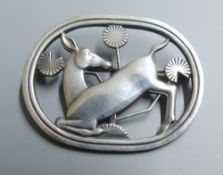 A Georg Jensen sterling 'kneeling deer' oval brooch, designed by Arno Malinowski, no. 256, 43mm.