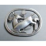 A Georg Jensen sterling 'kneeling deer' oval brooch, designed by Arno Malinowski, no. 256, 43mm.