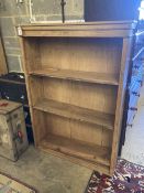 A Victorian pine open bookcase, width 108cm, depth 31cm, height 152cm