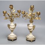 A pair of gilt metal and alabaster three branch candelabra, height 31cm (one a.f.)CONDITION: The