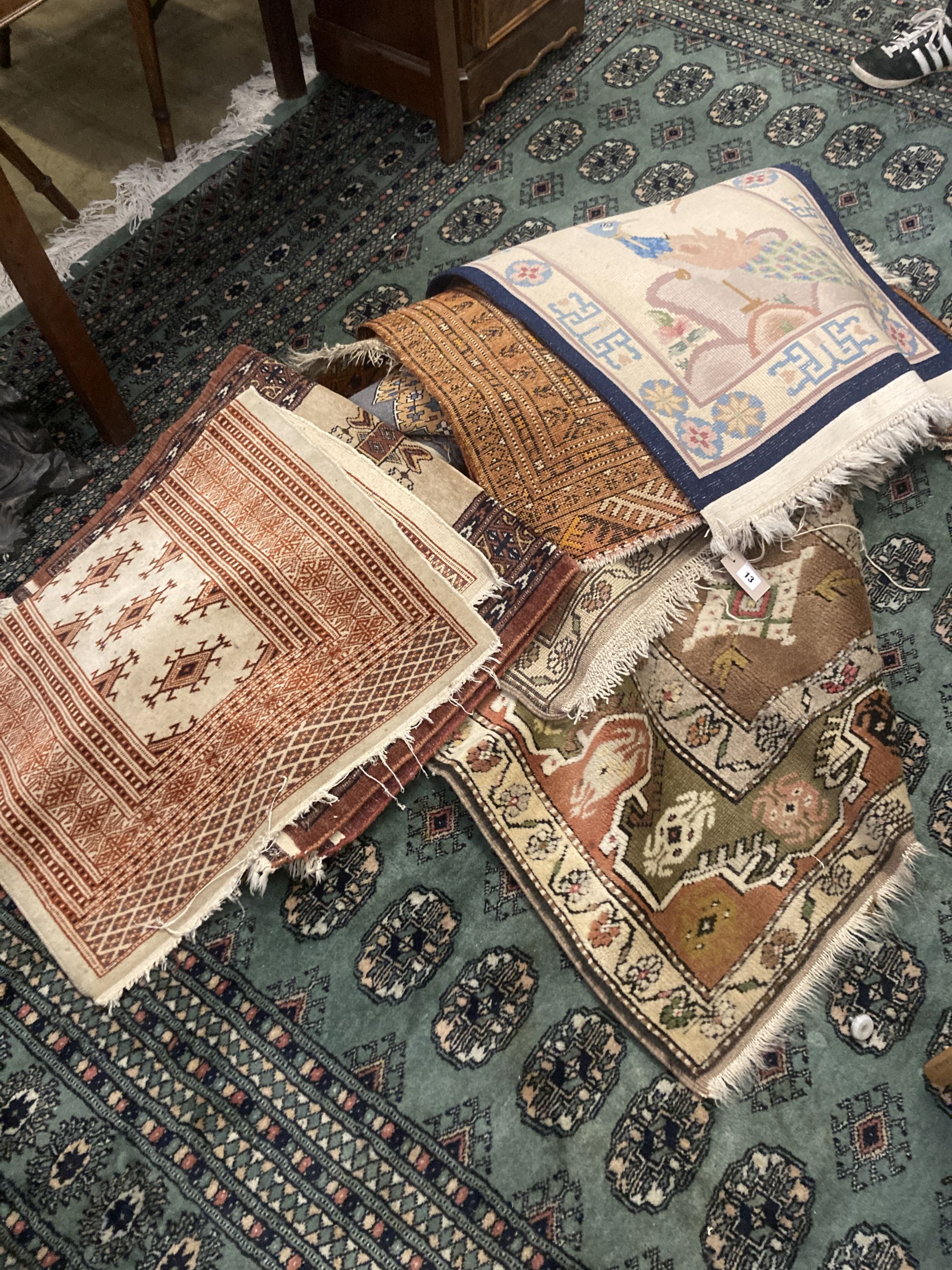 Ten Caucasian, Bokhara and North West Persian prayer mats and rugs and a Chinese mat, largest 150