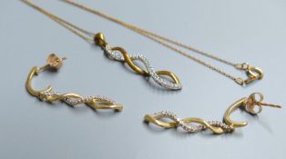 A modern 10kt and diamond chip set spiral pendant, 30mm, on a 10kt fine link chain, 45mm and pair of