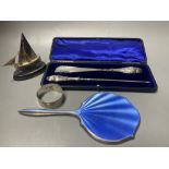A cased silver handled button hook and shoe horn, a silver and enamel hand mirror, a silver bangle