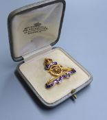 A cased early 20th century 15ct and four colour enamel Royal Artillery sweethearts brooch, width