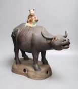 A large Chinese pottery group of a man riding an ox, Guandong kilns, height 40cmCONDITION: