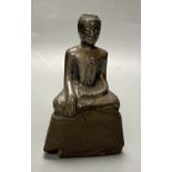 A 19th century Burmese silver overlaid wood figure of Buddha Shakyamuni, height 12cmCONDITION: