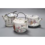 Two Chinese famille rose teapots and covers, and a calligraphic teapot, tallest 10cm