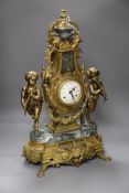 A Louis XVI style ormolu and variegated green marble mantel clock, of lyre form with urn finial,