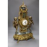A Louis XVI style ormolu and variegated green marble mantel clock, of lyre form with urn finial,