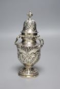 An ornate late Victorian silver sugar castor by William Comyns, London, 1897, 16.2cm, 7oz.CONDITION: