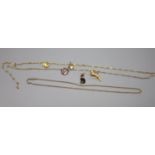 2 x 9ct necklaces, one hung with five assorted charms, gross 19.6 grams.