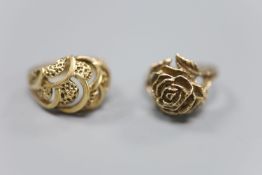 A 9ct plain and textured gold modernist design ring and a 9ct gold rose design ring, gross 11.3g