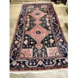 A Caucasian design peach ground rug, 290 x 145cm