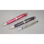 Two white metal and enamel roller ball Theo Fennell logo pens, one black and one pink, 14.4 x 10.4cm